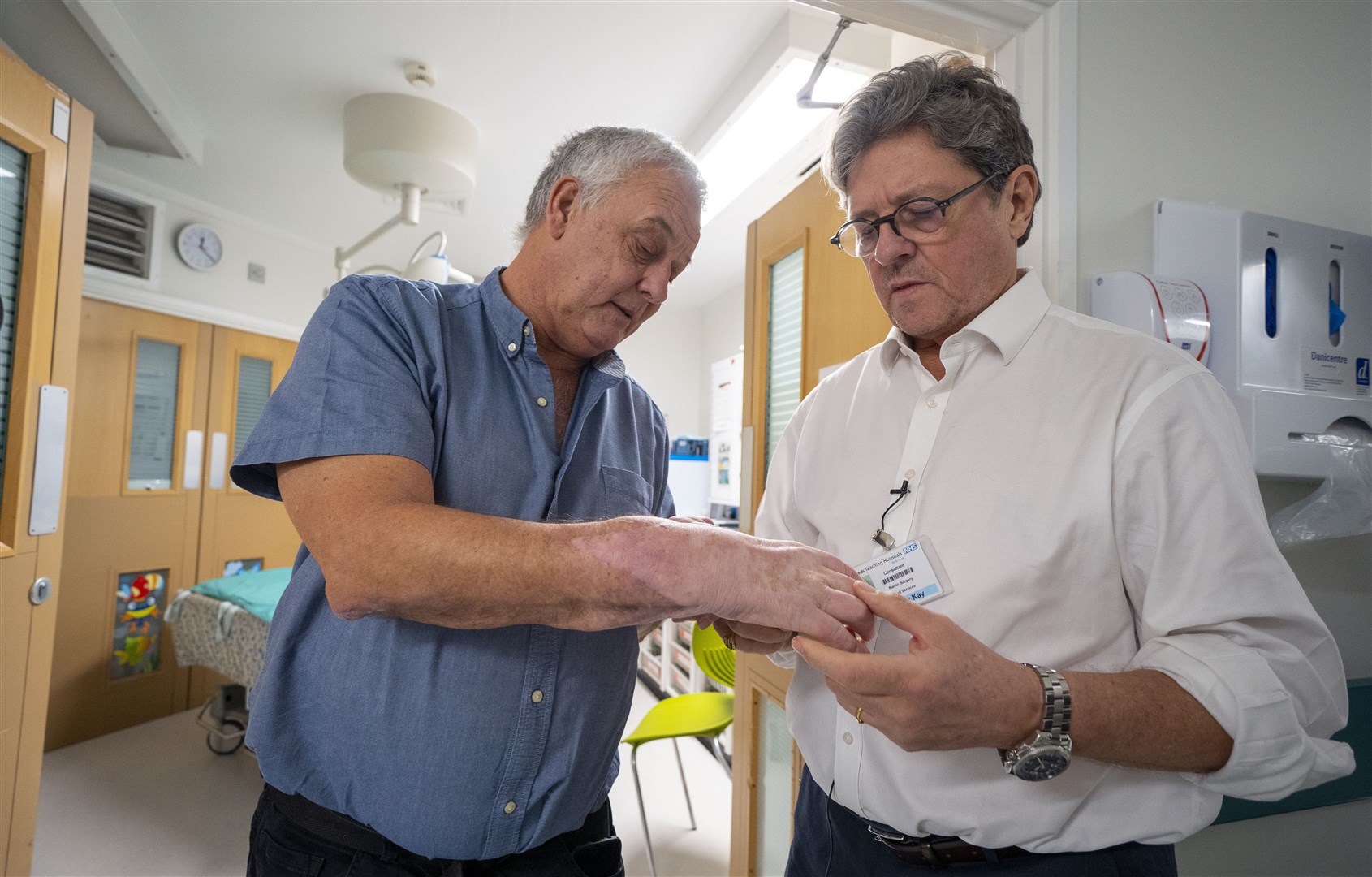 Mark Cahill (left) in 2012 became the first person in the UK to have a hand transplant (Peter Byrne/PA)